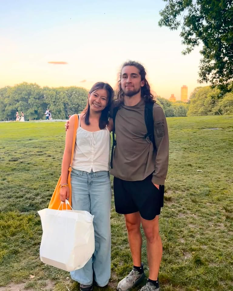 Two guests with the potluck bag at sunset